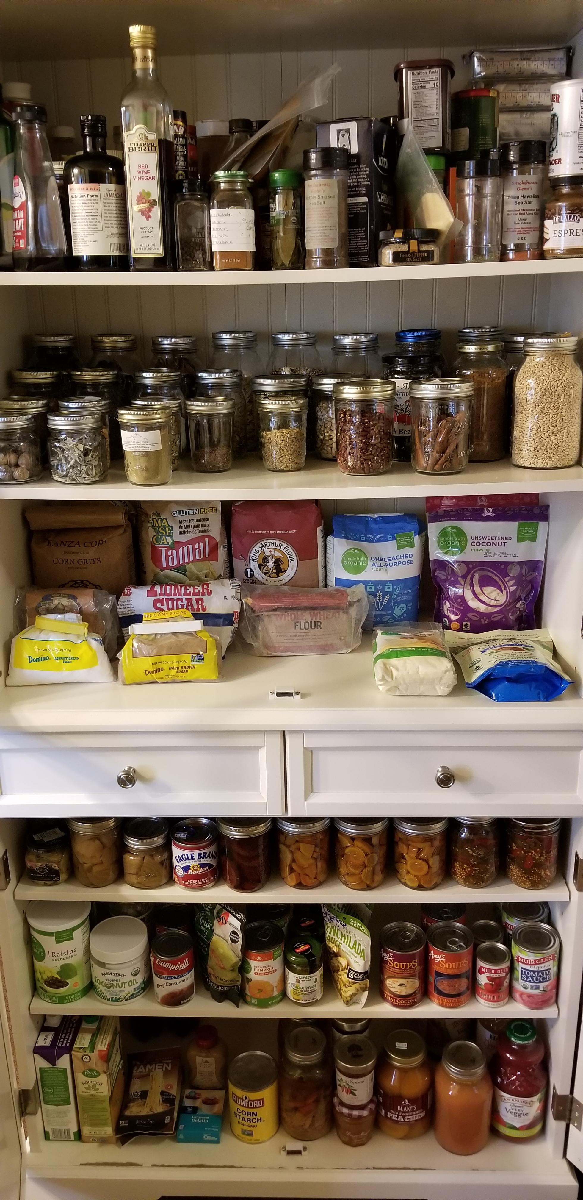 Pantry Progress Every shelf used to look like the top shelf. Spare canning jars replacing