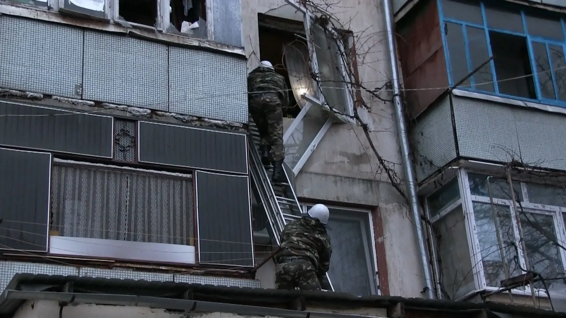 Rescuers at the scene of an explosion in an apartment building in ...