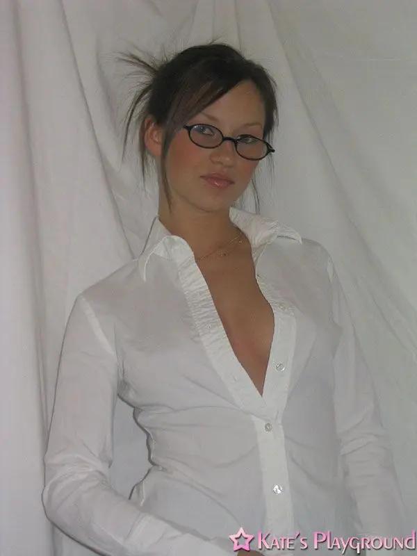 Kate in a sexy teacher outfit featuring a white blouse, tight grey pencil skirt, and glasses