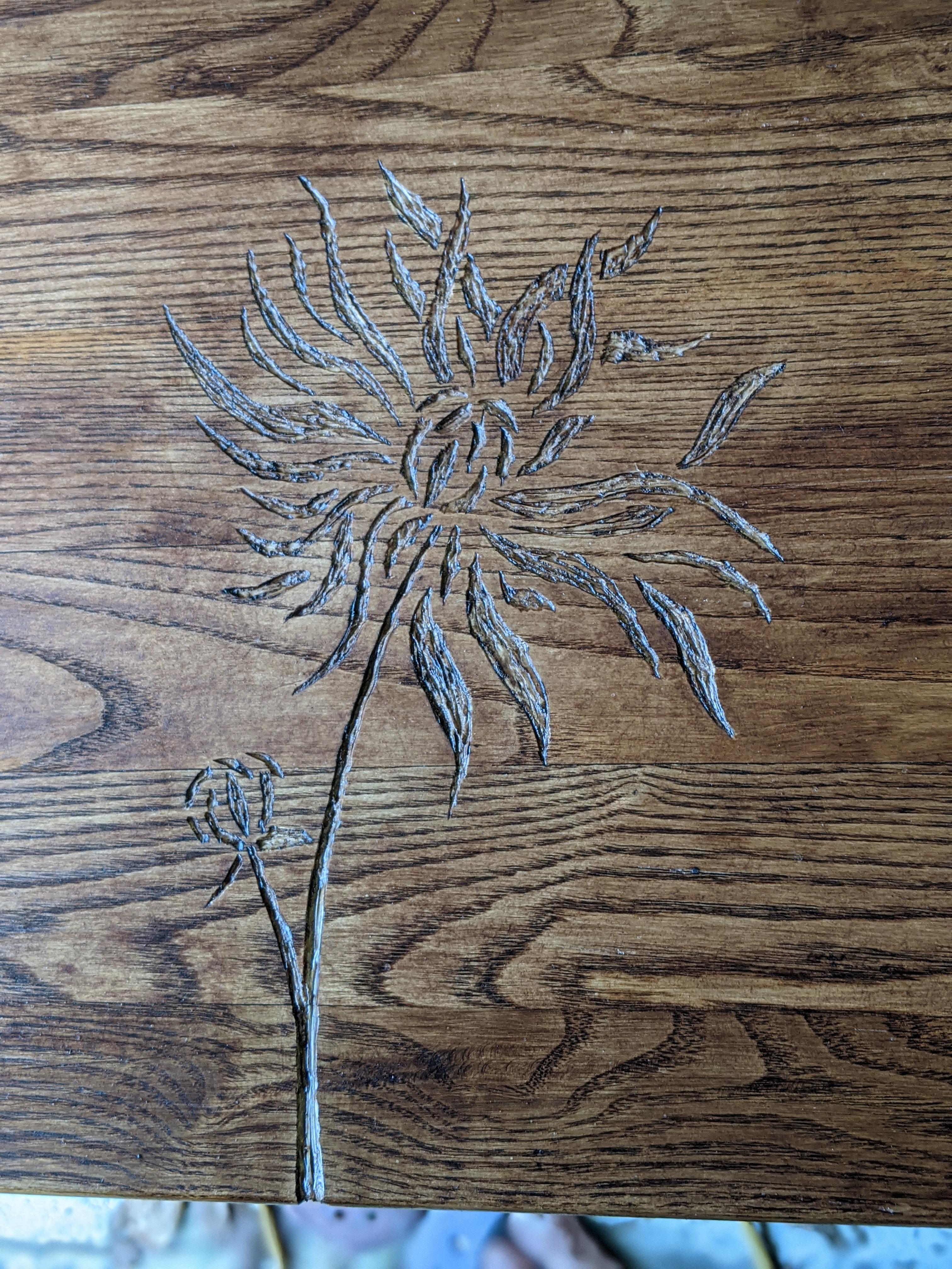 Simple flower engraving on oak | Scrolller