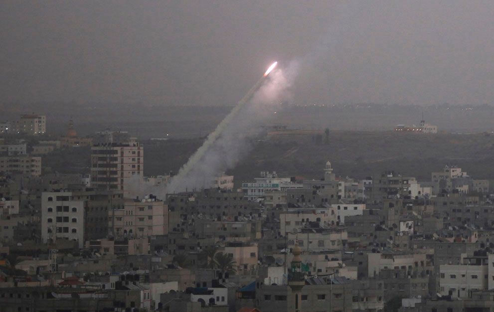 Smoke trails a crudely-built Qassam rocket, launched from the northern ...