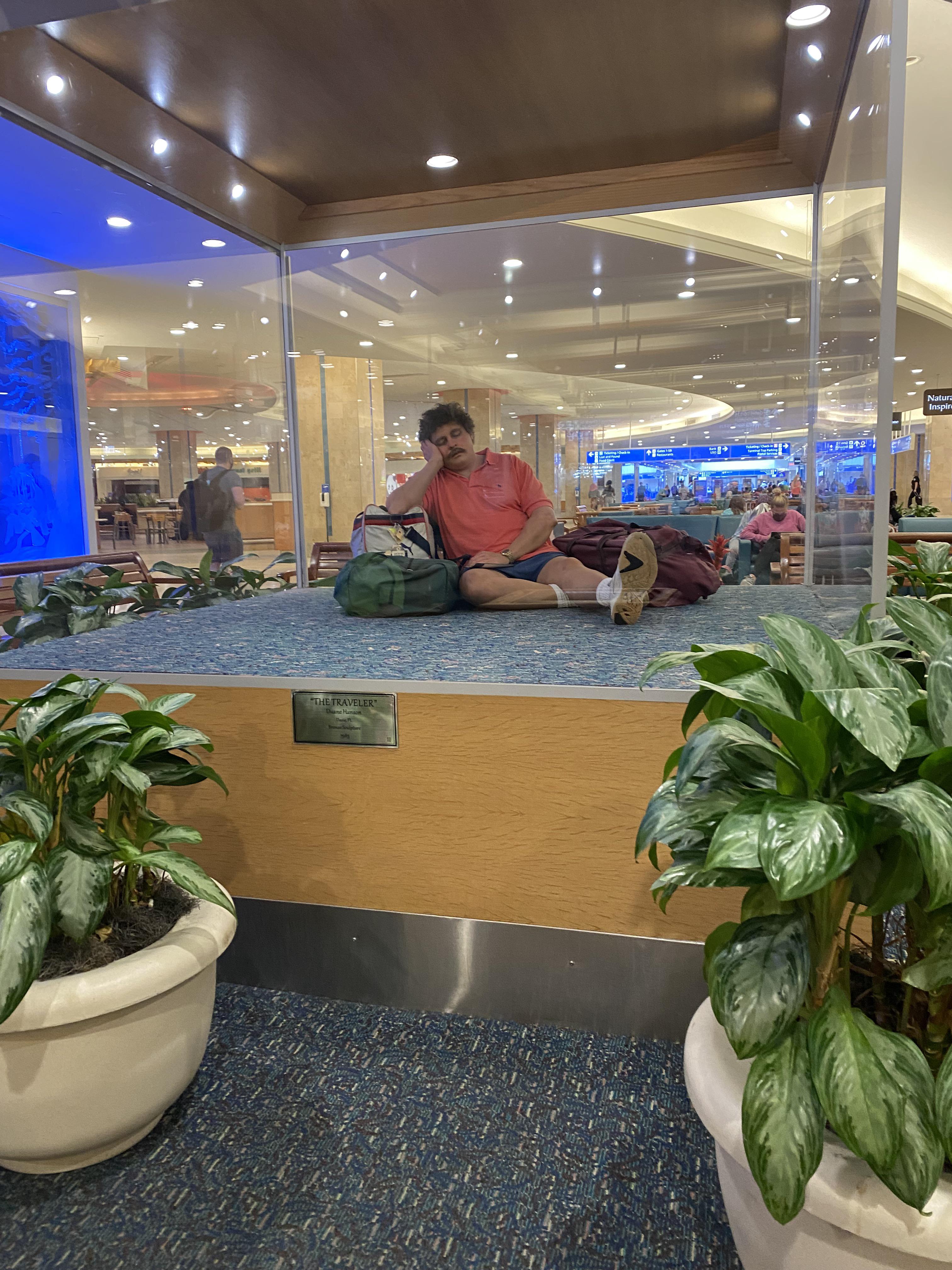 Statue at the Orlando airport. Inspired by dads from the 80s. | Scrolller