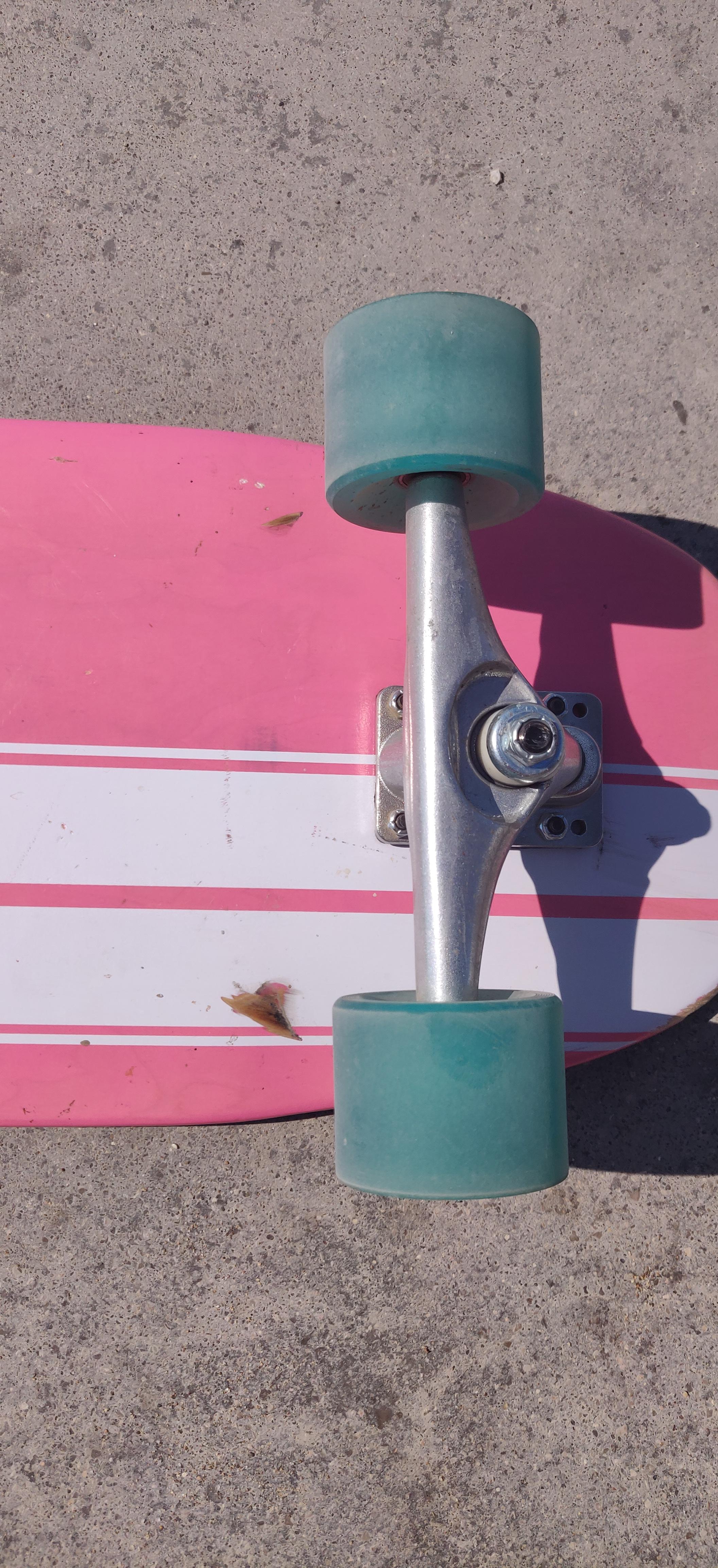 surfskate wheel bite, how to put off? with an angled riser maybe