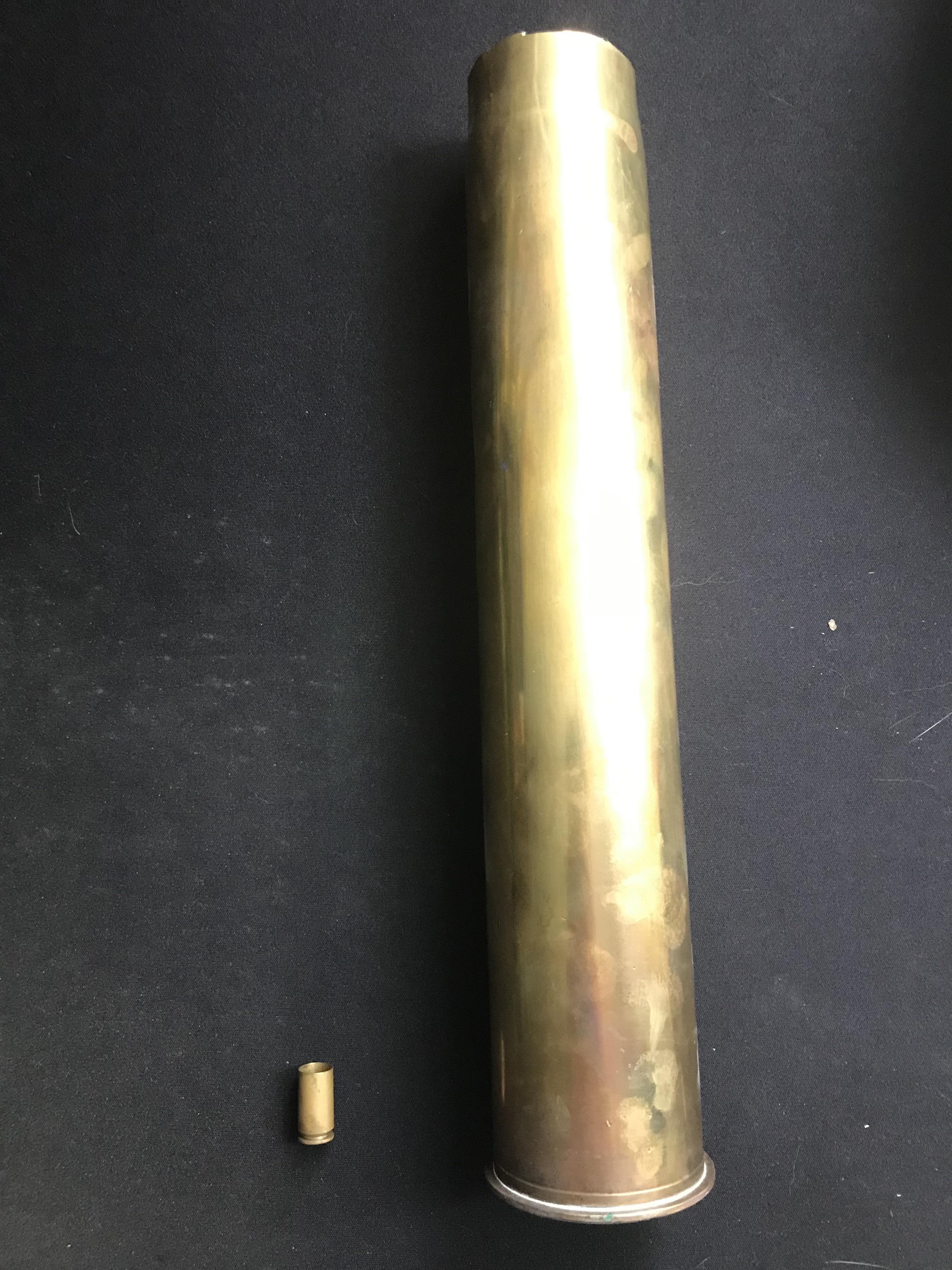 The size difference between a pistol cartridge and a tank shell | Scrolller