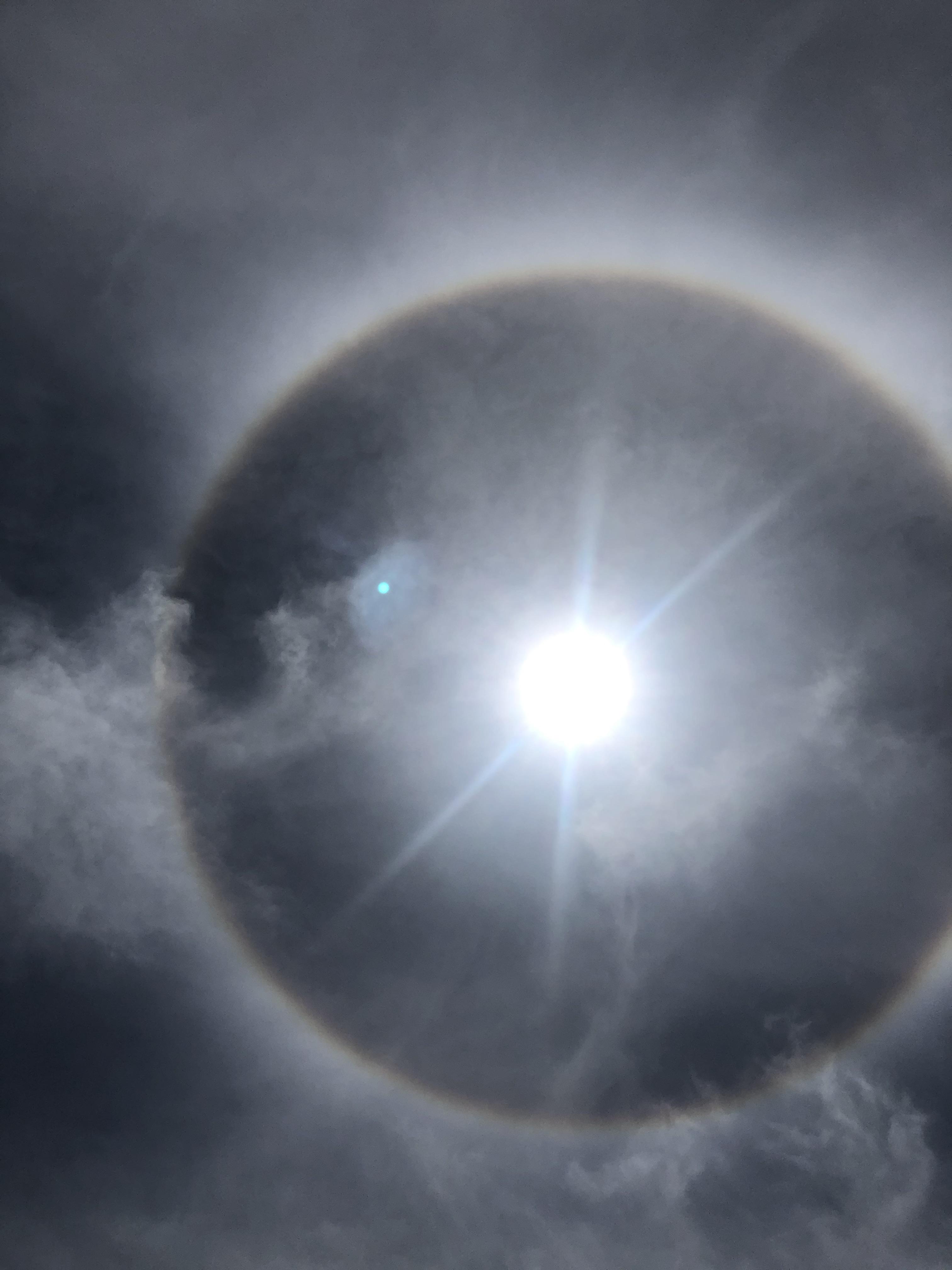 This is called a “glory” a full circle rainbow which is very rare to