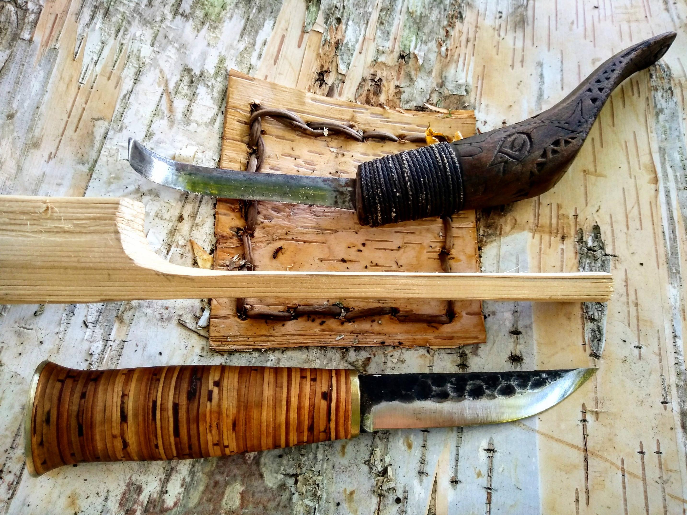Traditional tools for a traditional job. Building a birch bark Canoe ...