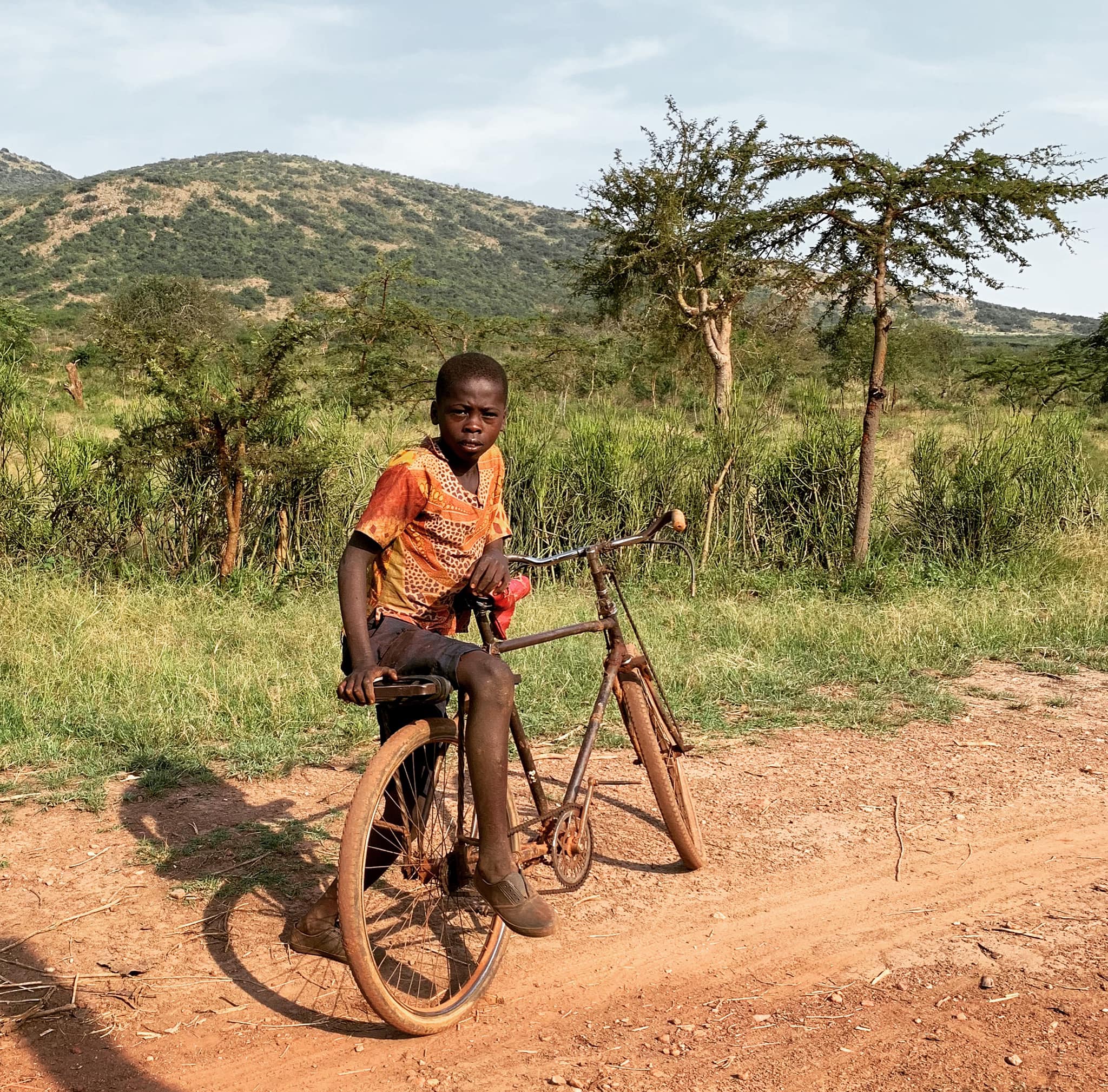 Traveling in Rwanda this boy stopped to check me out (I have tattoos ...