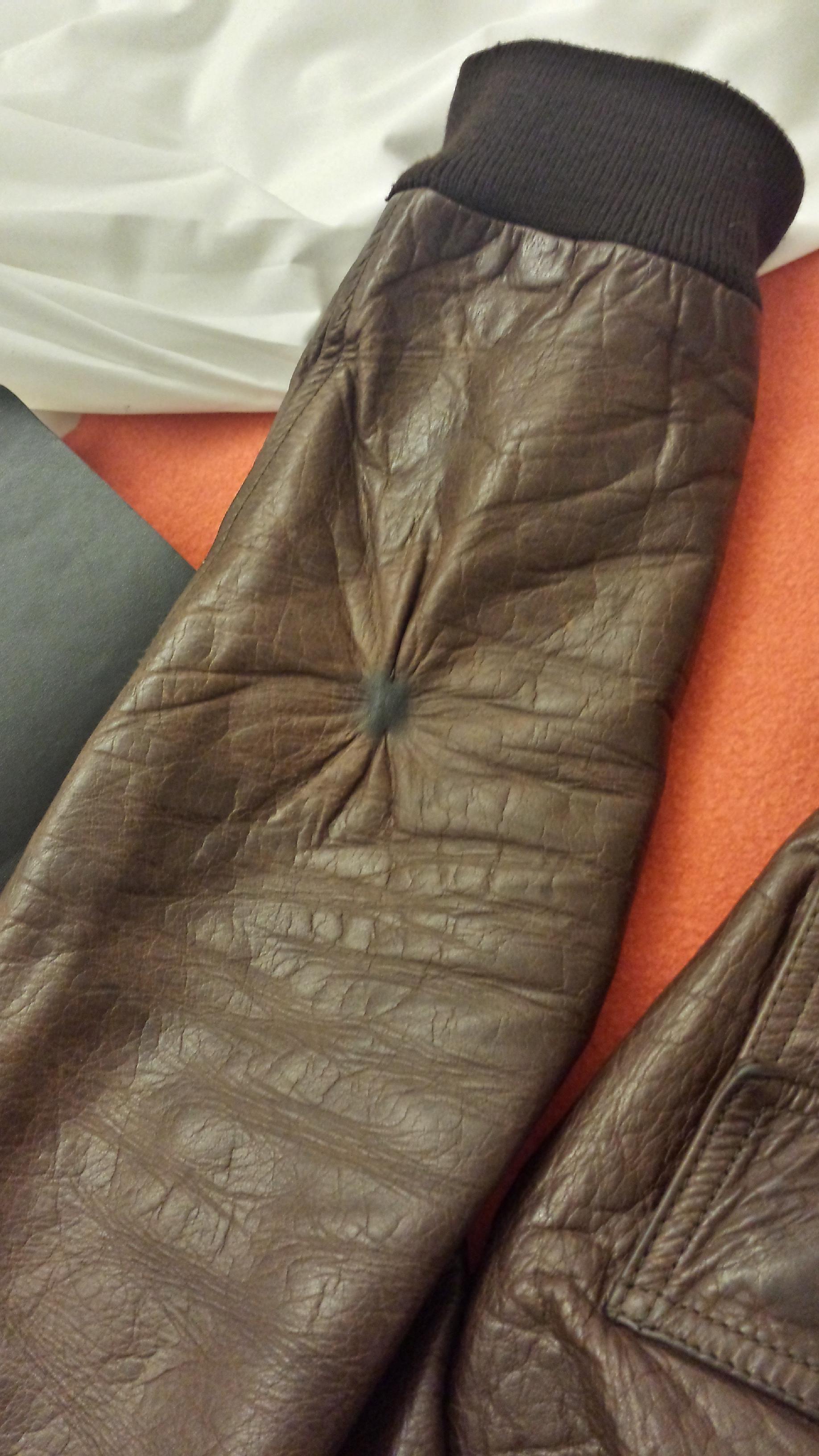 Weird damage to leather jacket. Any idea what did it or if it can be