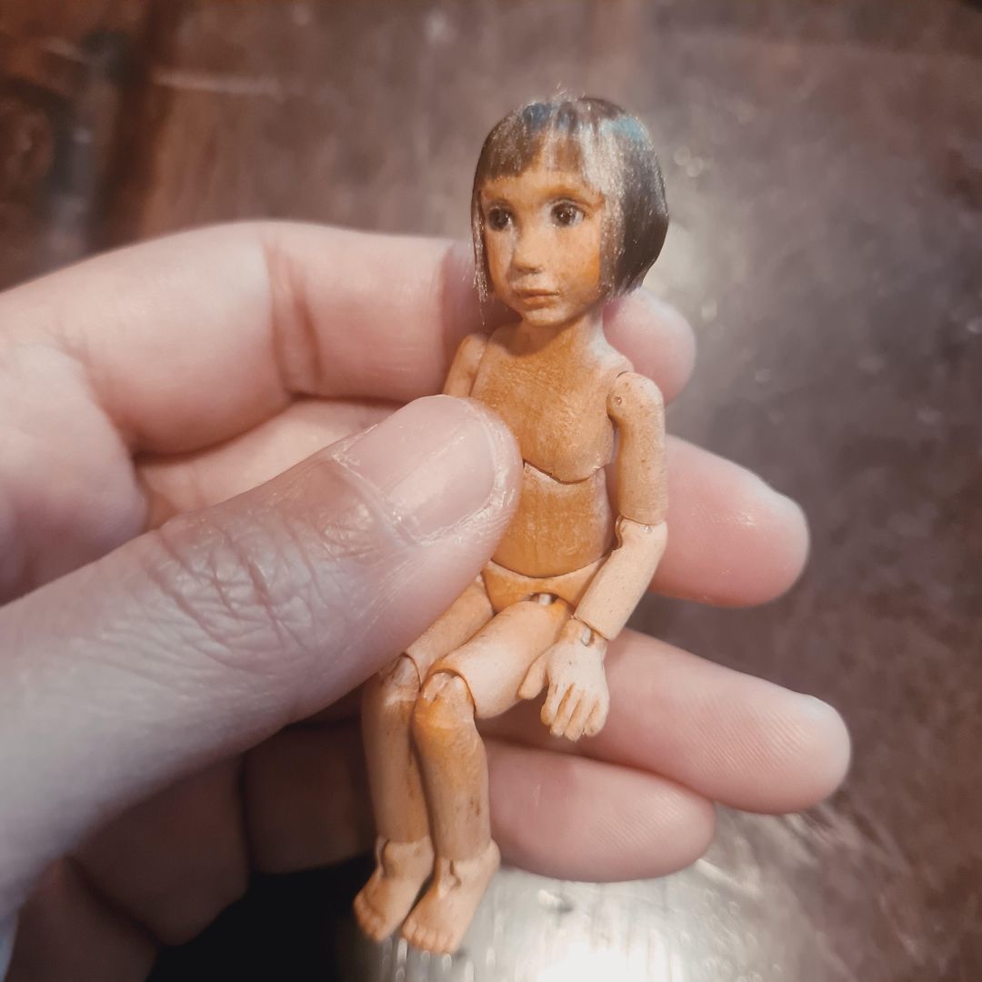 Almost finished wooden doll. Carved in bass and birch wood.