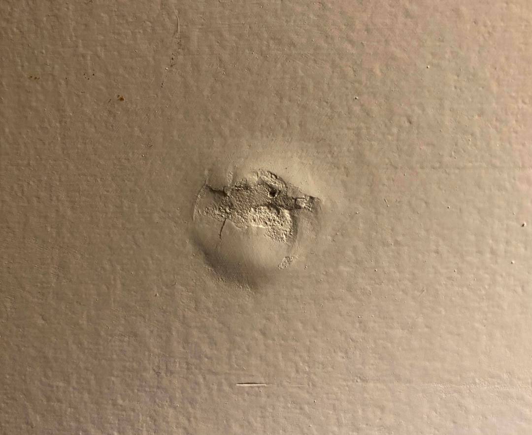 Baby Yoda has appeared on my wall in the form of a drywall screw pop