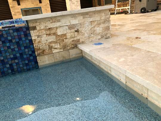 Brand new pebble sheen install leaving blue stain on tile- how do I get it off? Vinyl pool brush isn’t working