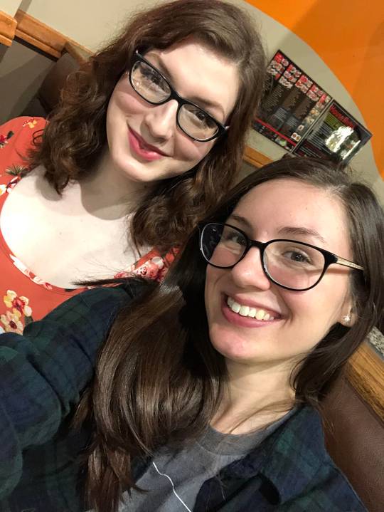 Celebrating my birthday with my sister! (I’m in red and she’s in plaid.)