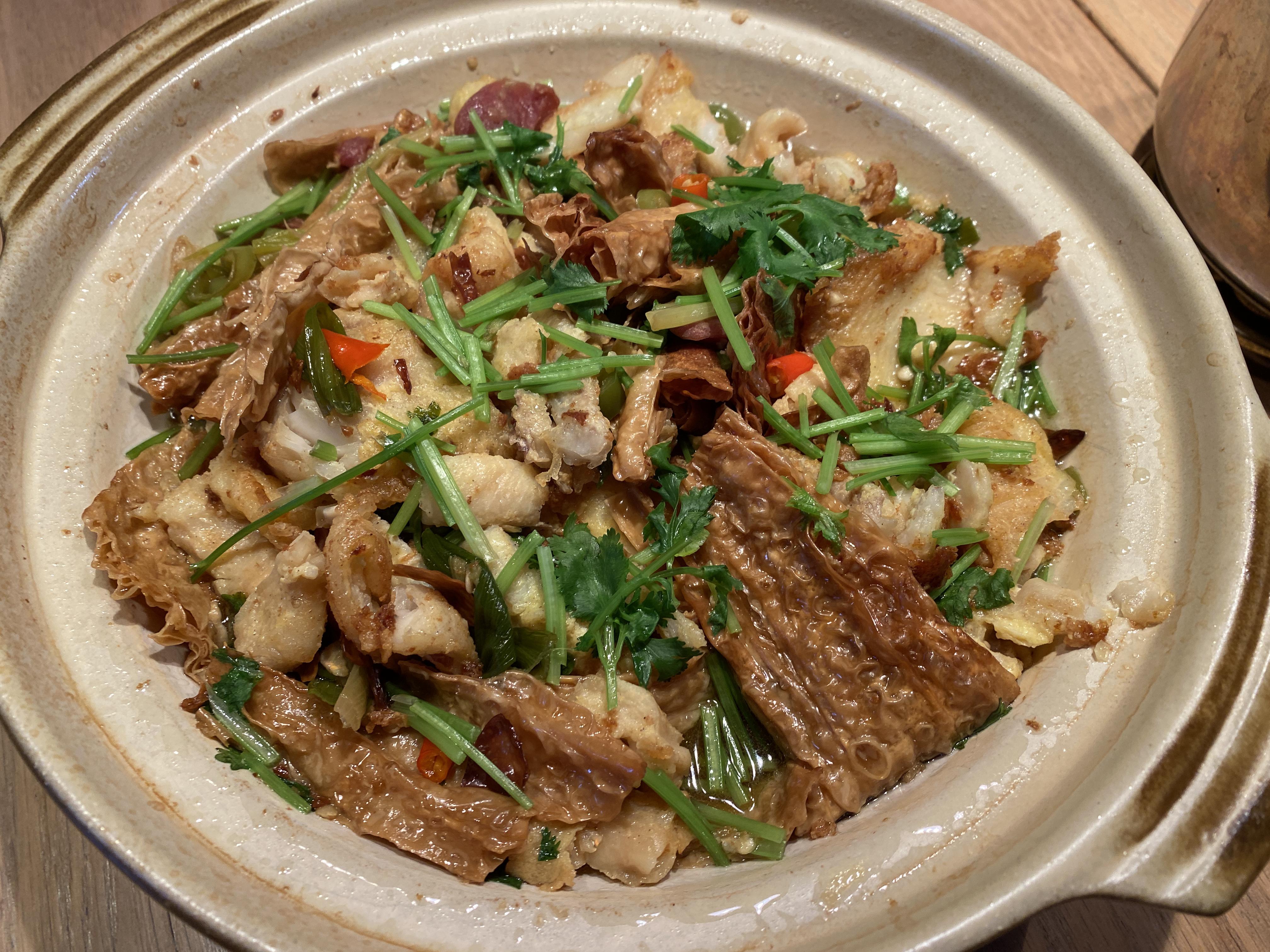 Clay pot rice with fried fish, bean curd, Chinese sausage, and cilantro ...