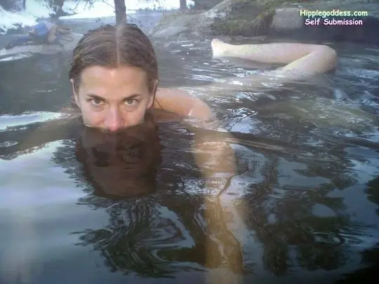 Clover from Hippie Goddess posing nude and in a bikini in snowy outdoor hot springs
