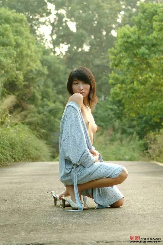 Cute Chinese woman with tiny asian tits posing nude and in a robe with high heels in an outdoor park