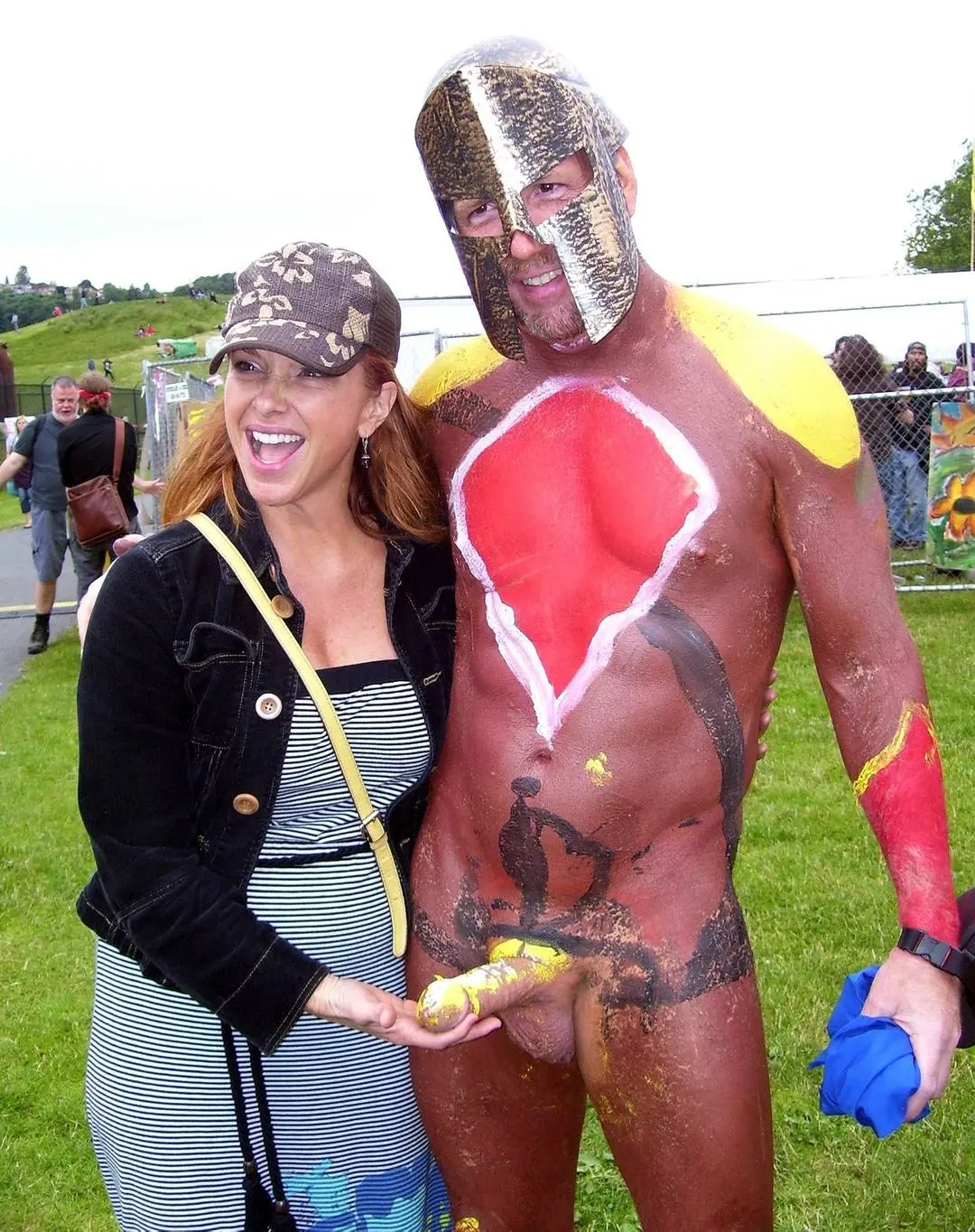 Hung white man posing nude with women in costumes at Bay to Breakers street fair, CFNM public exhibitionism