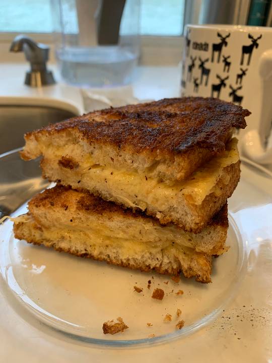 First time making grilled cheese: rye bread with smoked Gouda, butter and pepper.