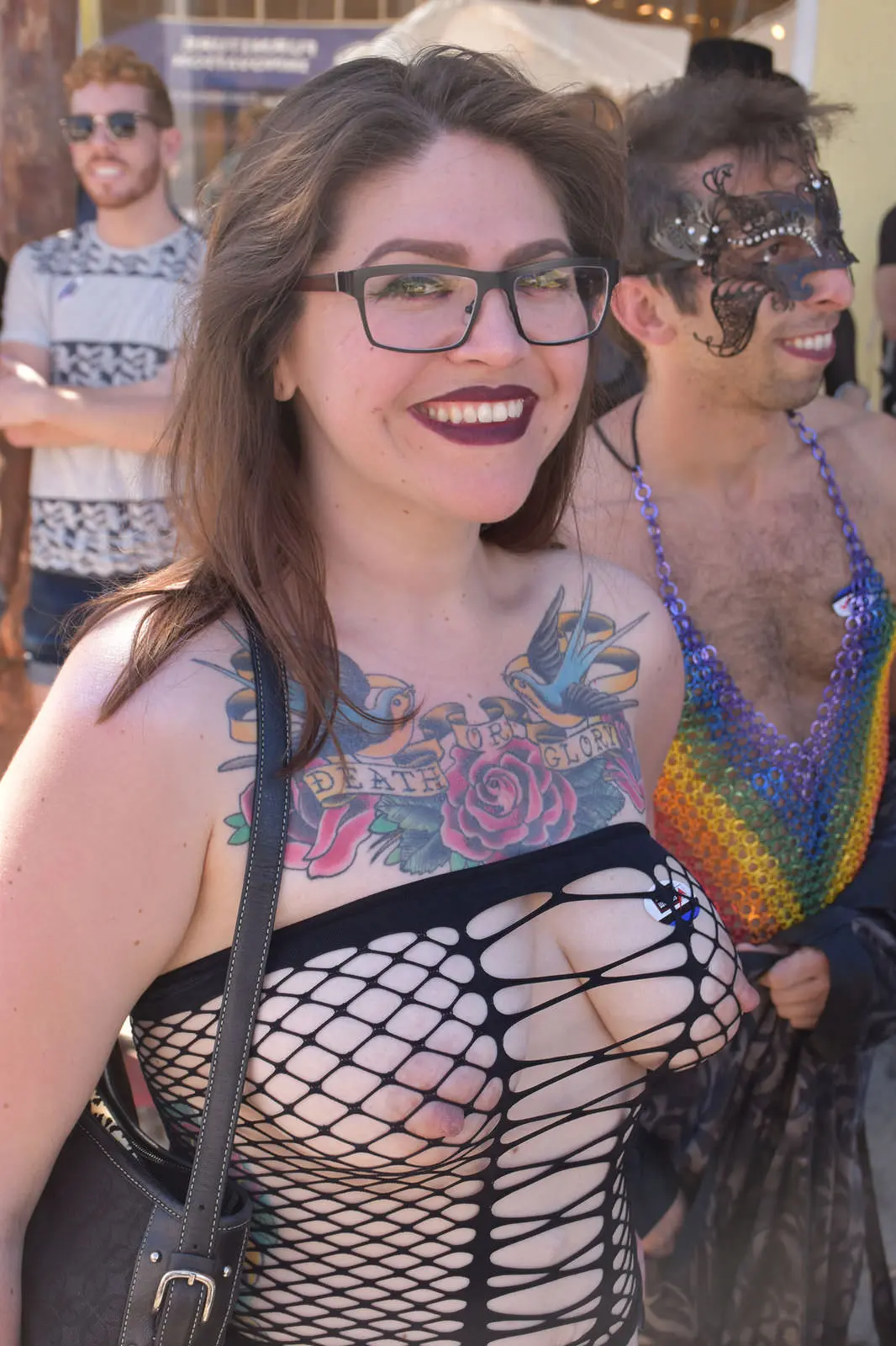 Women in bondage harnesses, leather corsets, and lace lingerie at the Folsom Street Fair.