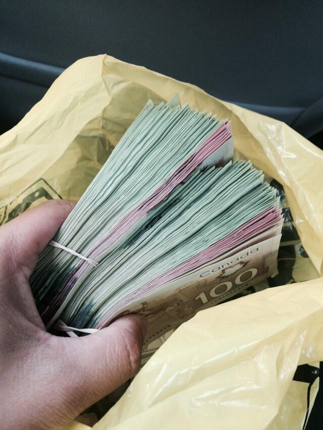 Found a bag in Kensington market today tied to the Kensington sign. Just opened it, there was 10,000 cash.