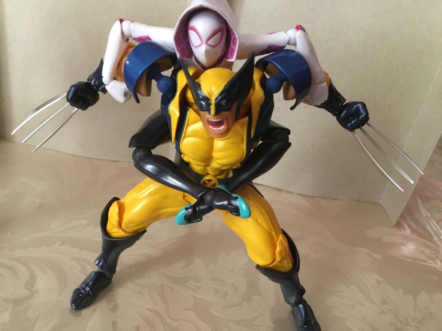Gwen: “Urgh....Haah... Okay... Wolvie....I’d really...appreciate it if you’d just calm down, your scaring away my fans! Urgh... damn your strong.....”