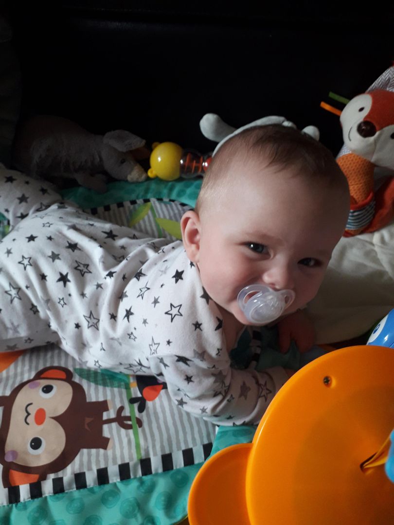 He mastered rolling from his front to his back a few weeks ago, but today he managed the other way! He looks so proud!