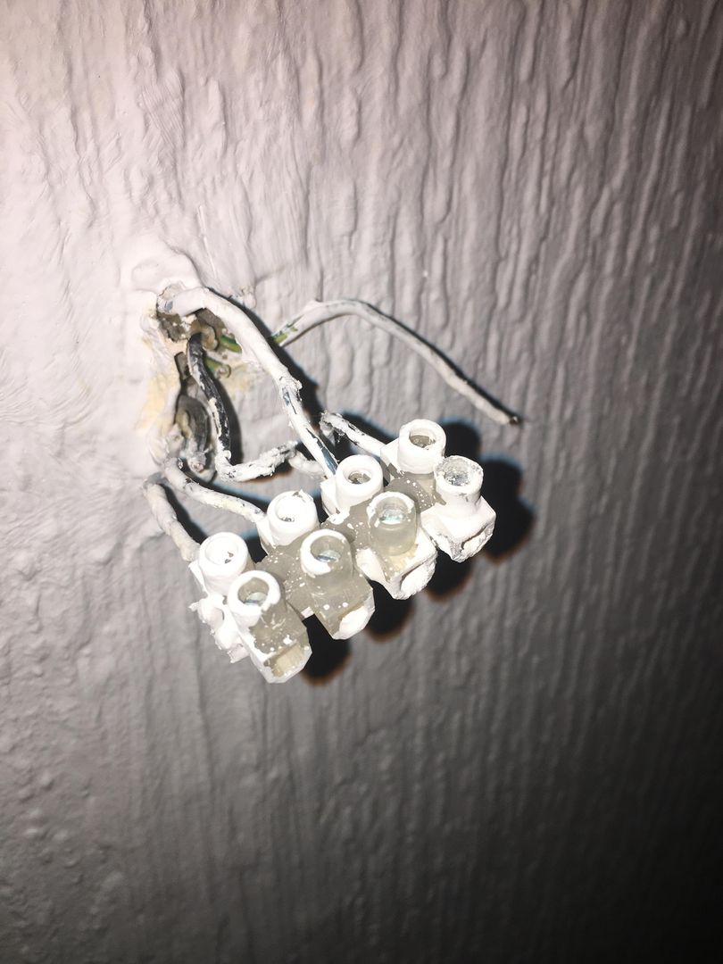 Hello people, we are trying to wire our new wall lights but this looks so complicated! The left 5 cables have no electricity, we‘ve tried every single switch but nothing turns them on. The sixth cable on the right has constant electricity that never turns off. We don’t know what to do, help!