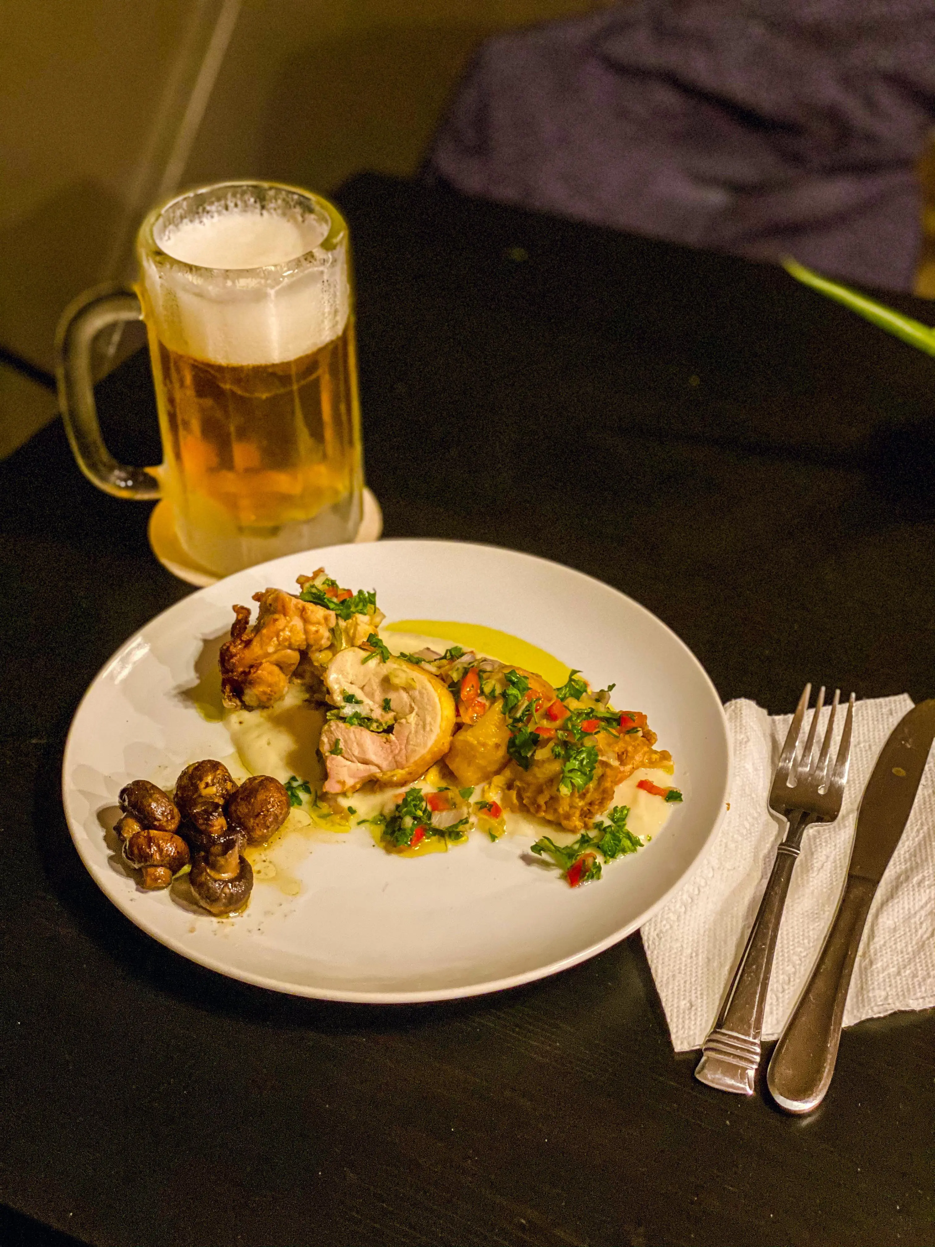 Chicken thigh ballotine with red bell pepper chimichurri on a ...