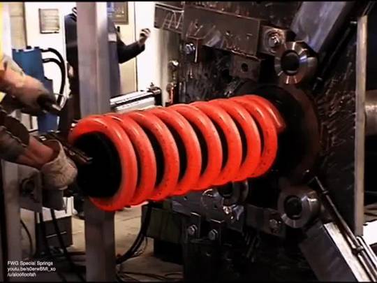 Hot coiling a huge spring