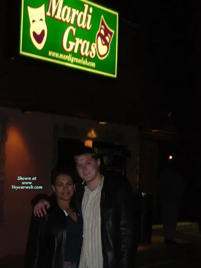 Hotrican busty latina woman and white man in a car, woman flashing her breasts