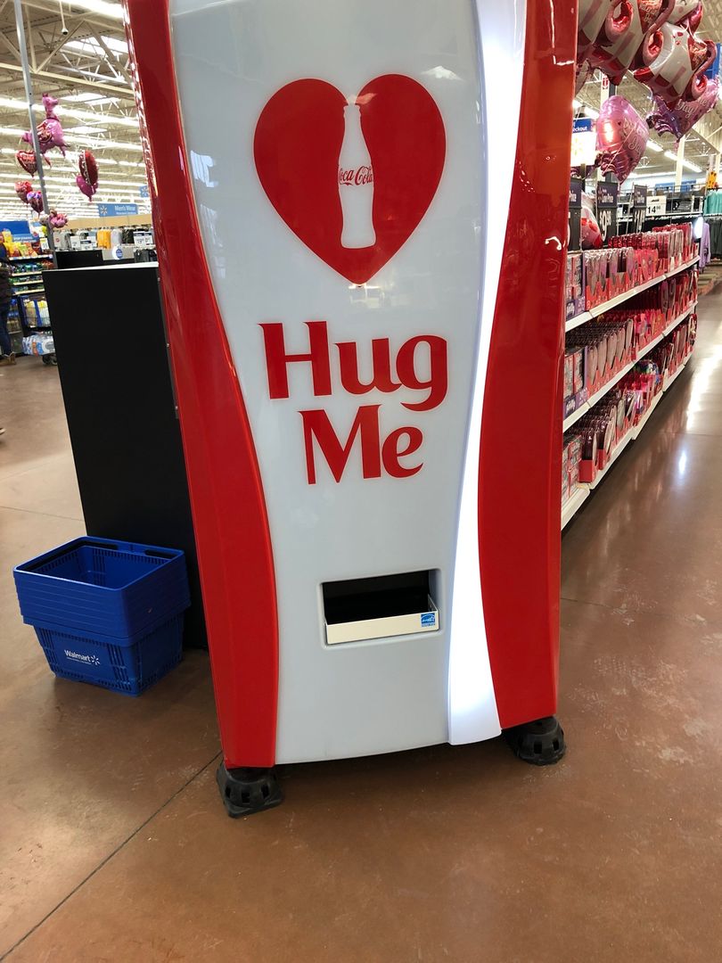 Hug this coke machine and get a free coke