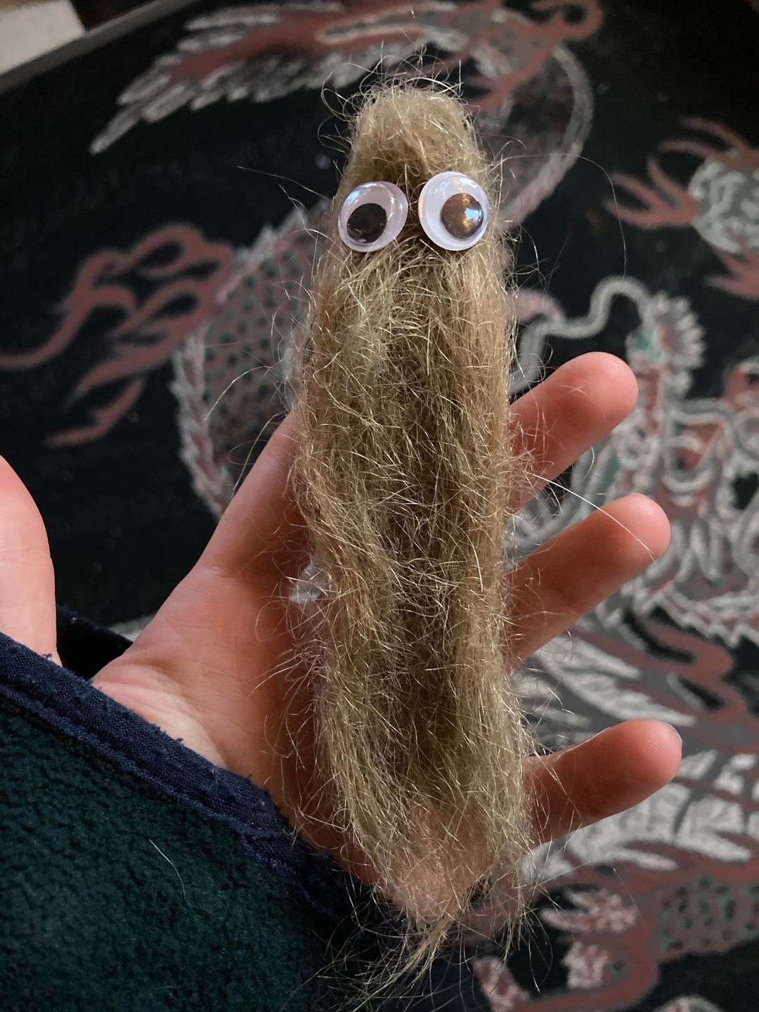 I cleaned out my hairbrush and threw the hair out. I guess my husband thought it would be a good toy for our toddler who is now obsessed with it