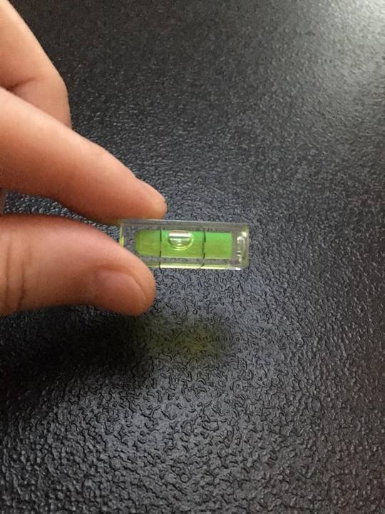 I found this itty bitty level in my junk drawer.