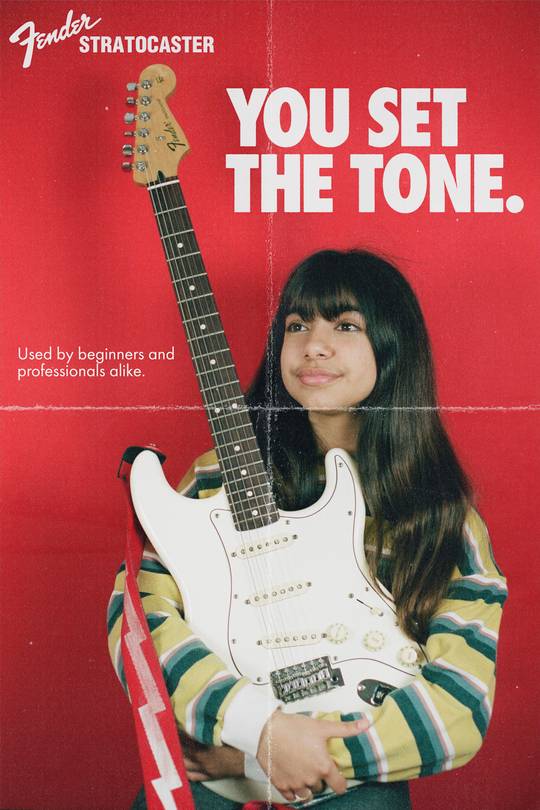 I took this photo of my sister holding my strat with my film camera. I then edited it to make it look like a vintage magazine ad.