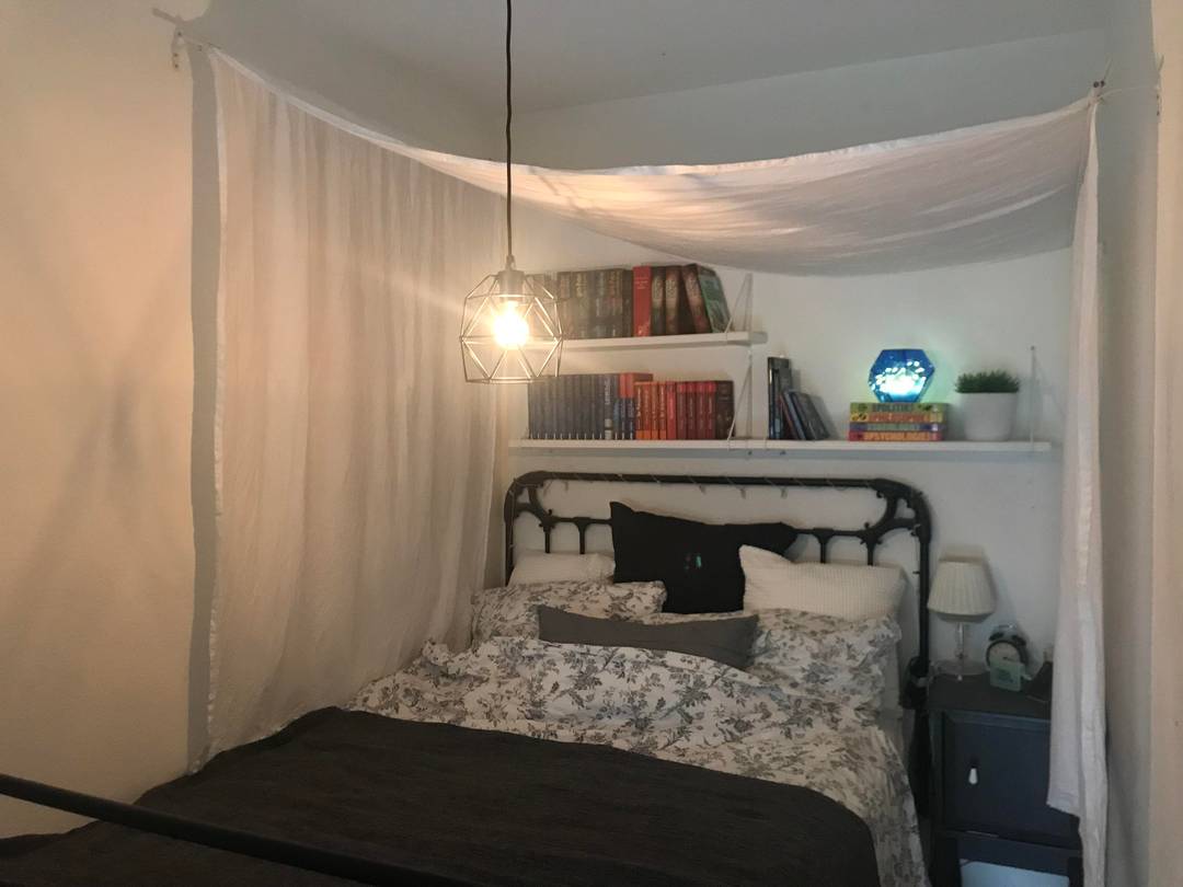 I upgraded my sleeping area with a DIY canopy (two IKEA cornices and cloth) and more IKEA textiles, a new lamp and shelves.
