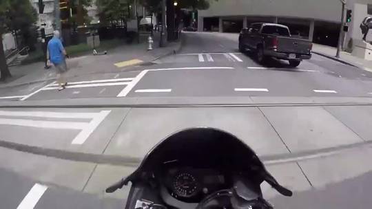 Motorcyclist crashes and is not happy about an illegal left turn