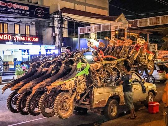 In Cambodia a pickup truck can transport up to 15 dirt bikes at a time for $15 per 4 hours per bike. Not a single ratchet strap in sight.