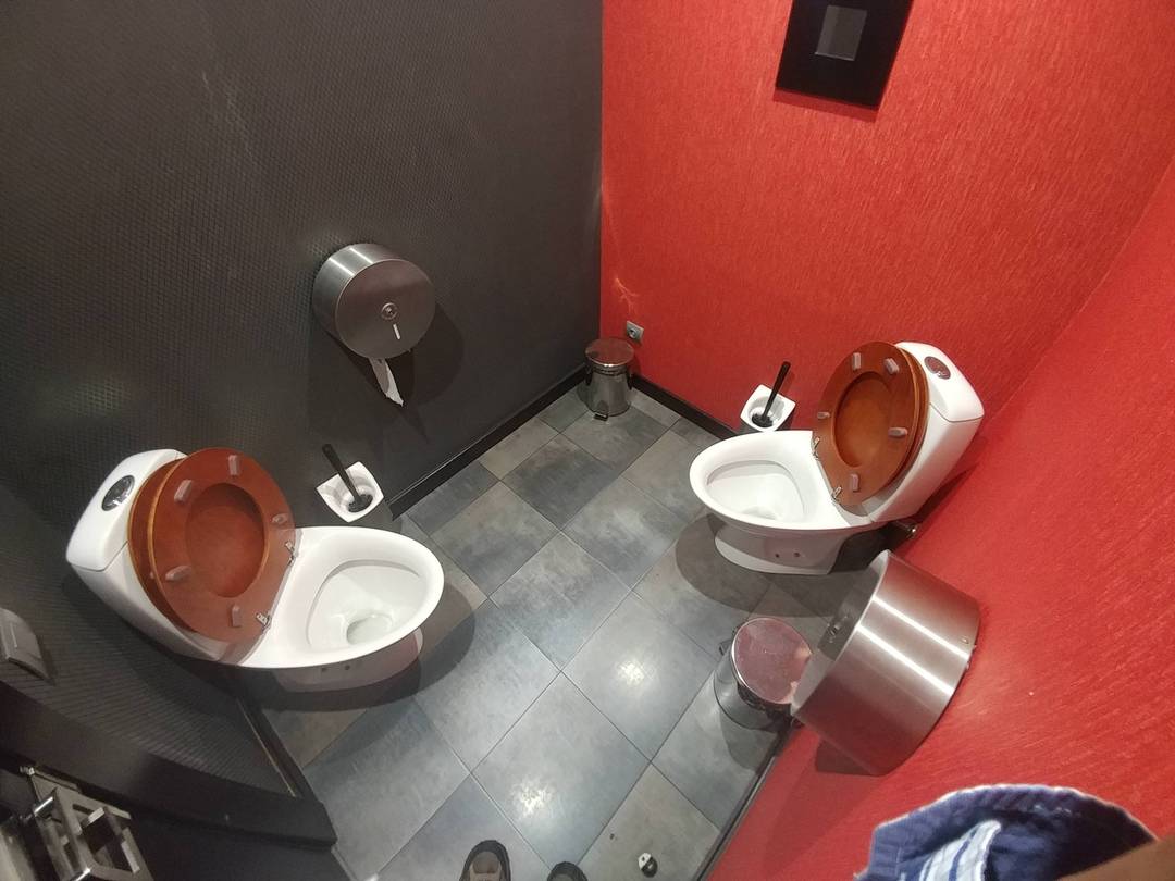 Sneaky feet in weird bathroom