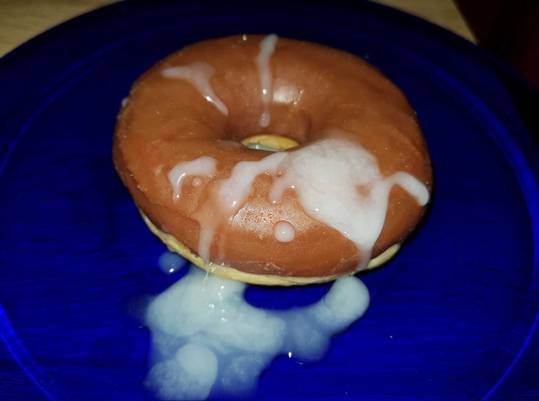 Cum eating challenge featuring a glazed donut on a blue plate covered in cum.