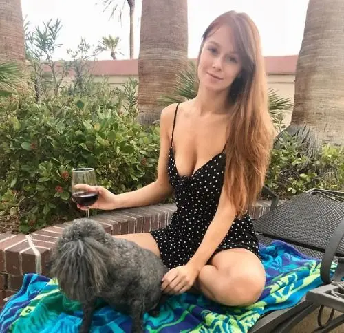 Leanna Decker, a busty redhead in lingerie, swimwear, and nude poses.