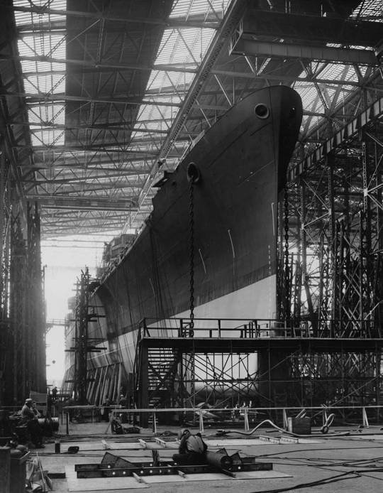 On the eve of her launching, Baltimore-class heavy cruiser USS Macon (CA-132) stands on the ways. New York Shipbuilding Corp., Camden, NJ. Oct. 1944. [757 × 973]