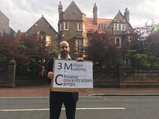 Jewish man holding a solo protest in front of Chinese embassy in London over Muslim's treatment.