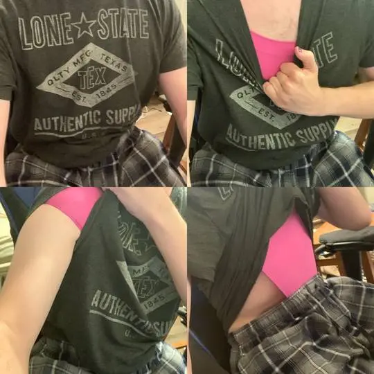 Person in a grey graphic t-shirt, pink underwear, and plaid pajama pants.