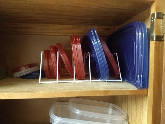 Purchased a plate rack from Dollar Tree to keep my tupperware lids sorted