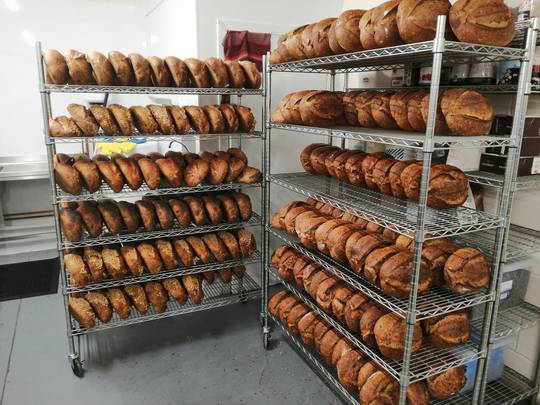 Racking them and stacking them (this is about 2/5ths of the bread for tomorrow). Happy weekend folks.
