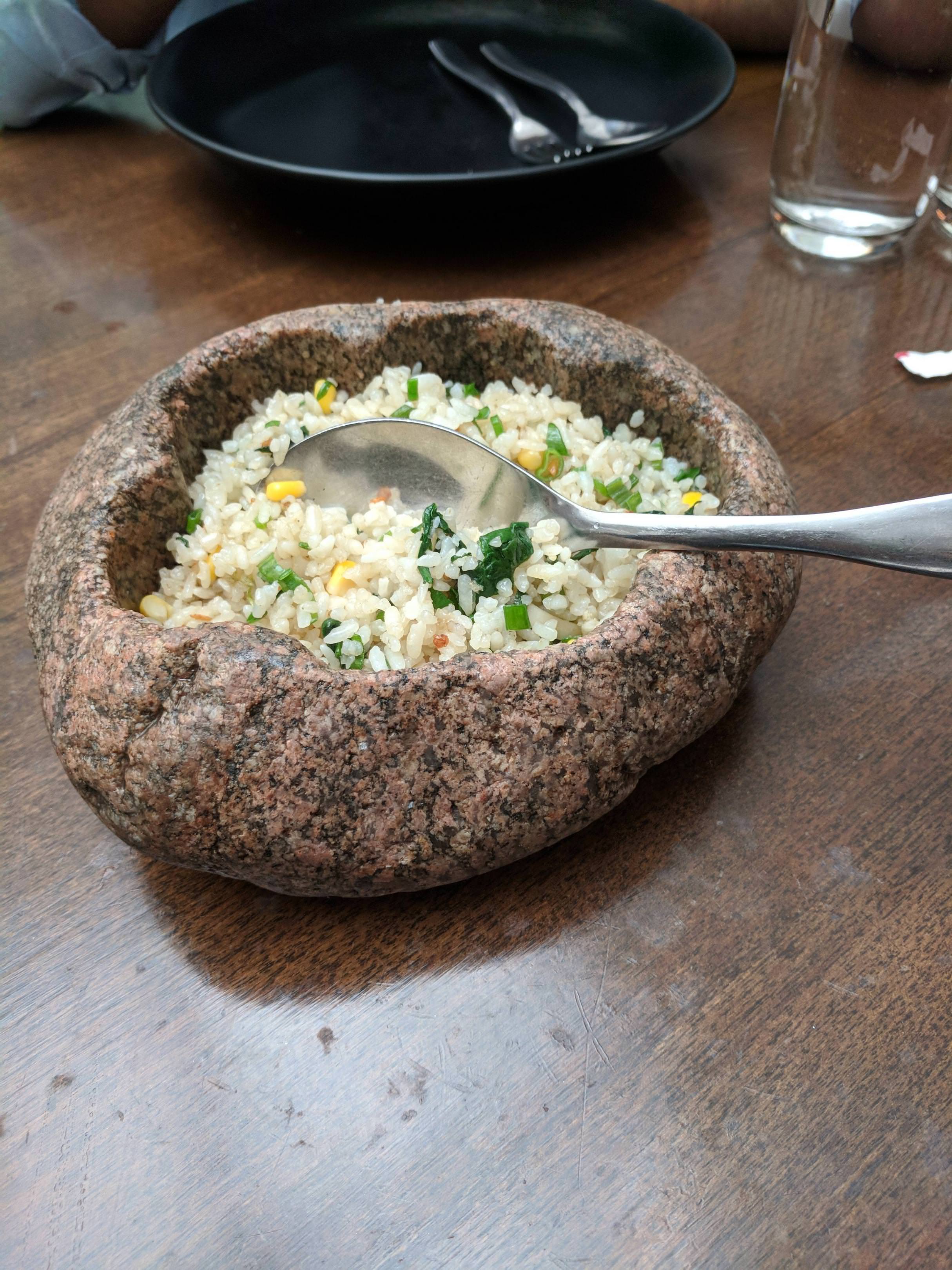 Rice in a carved out rock | Scrolller
