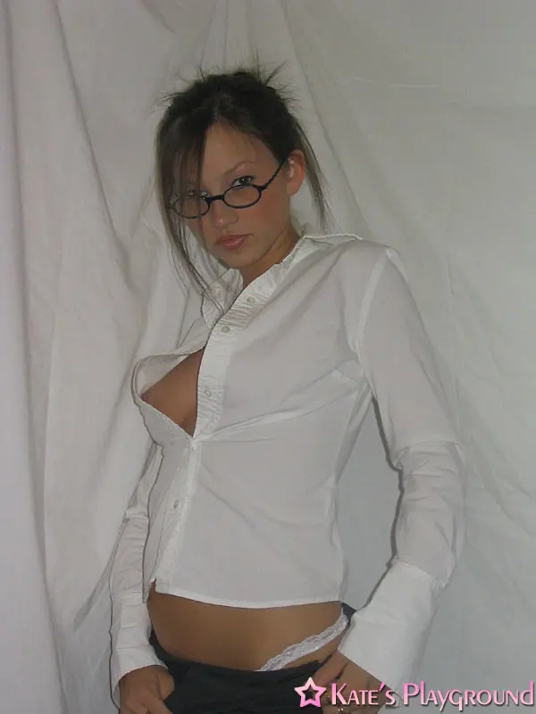 Kate in a sexy teacher outfit featuring a white blouse, tight grey pencil skirt, and glasses