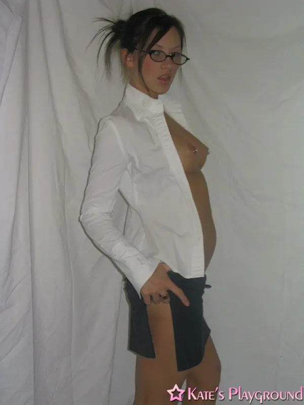 Kate in a sexy teacher outfit featuring a white blouse, tight grey pencil skirt, and glasses