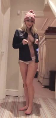 Taking her shirt off