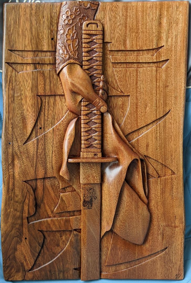 "The Bloody Bride" - by me. I haven't figured out the type of wood (much harder than I had expected), and carved with hand tools and a Dremel. Untrained and very happy with the result!