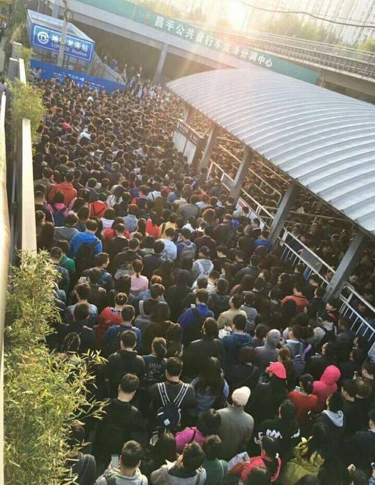 the crowd people at the subway gate in beijing during the 19th party congress